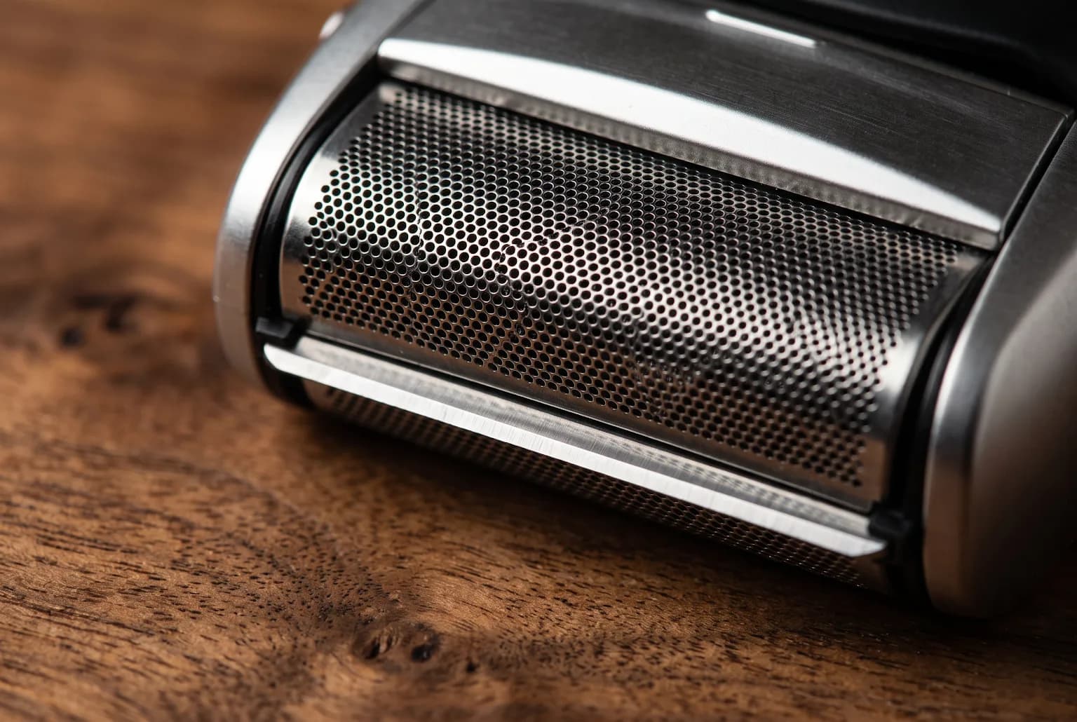 Close-up of foil shaver head showing perforated foil and blade gap