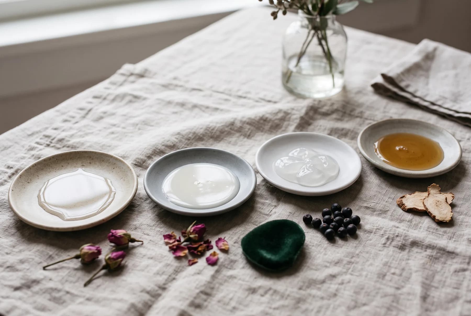 Mature woman layering a lightweight essence in an evening routine