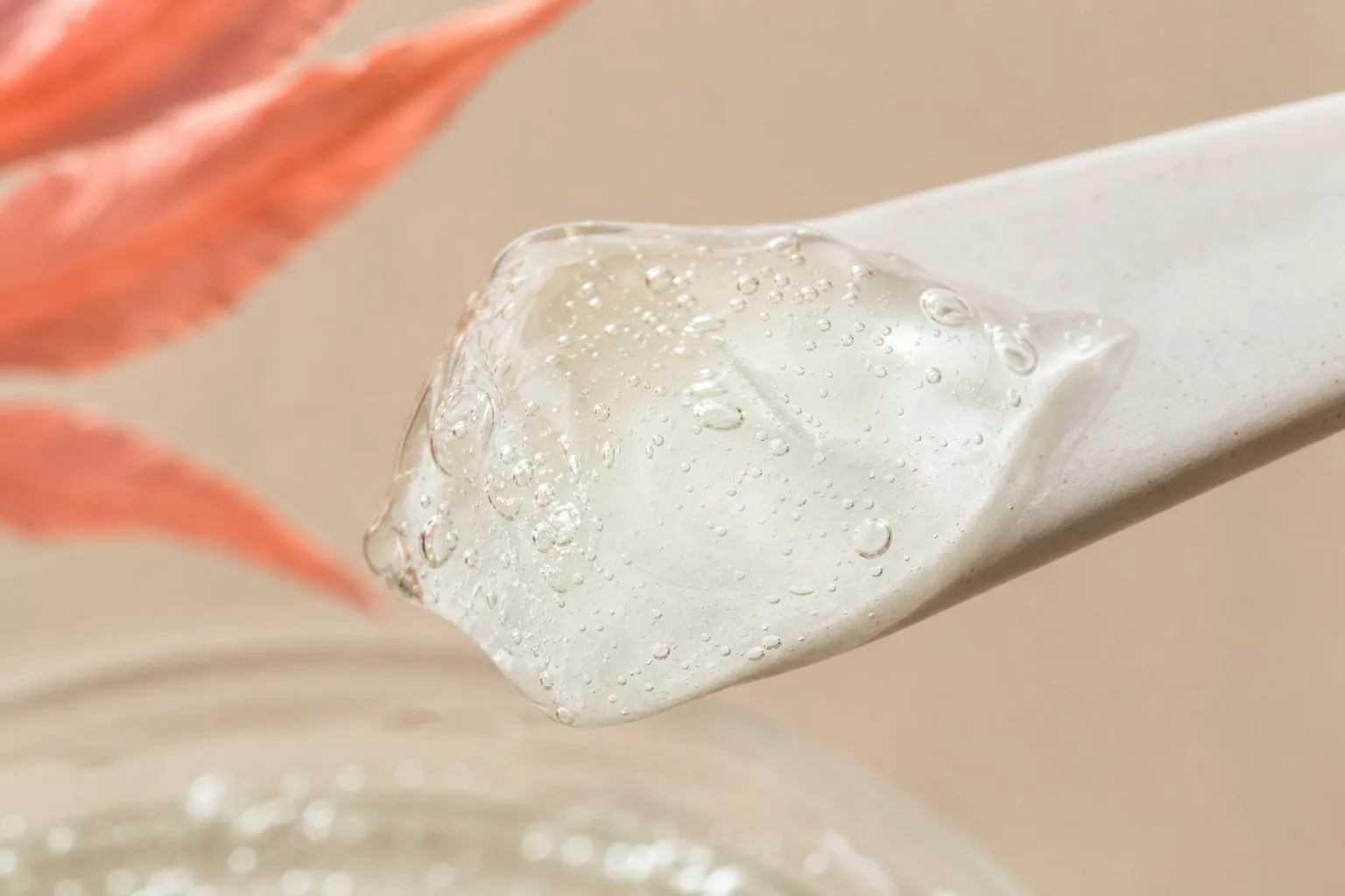Macro of translucent gel on ceramic spatula showing lightweight texture