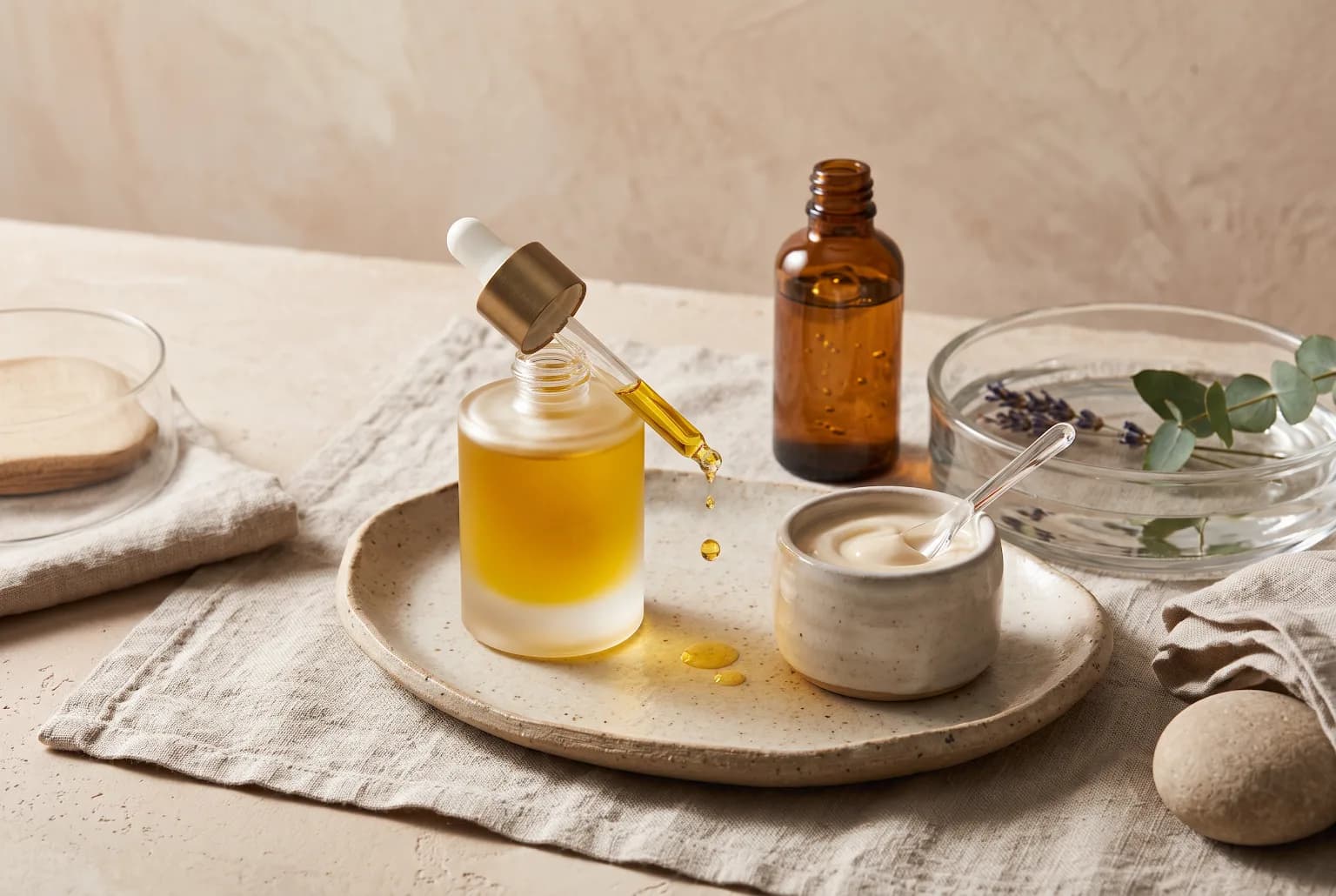 Sunlit vanity scene with a textured mirror, silk robe, and skincare tools arranged as a refined anti-aging routine still life