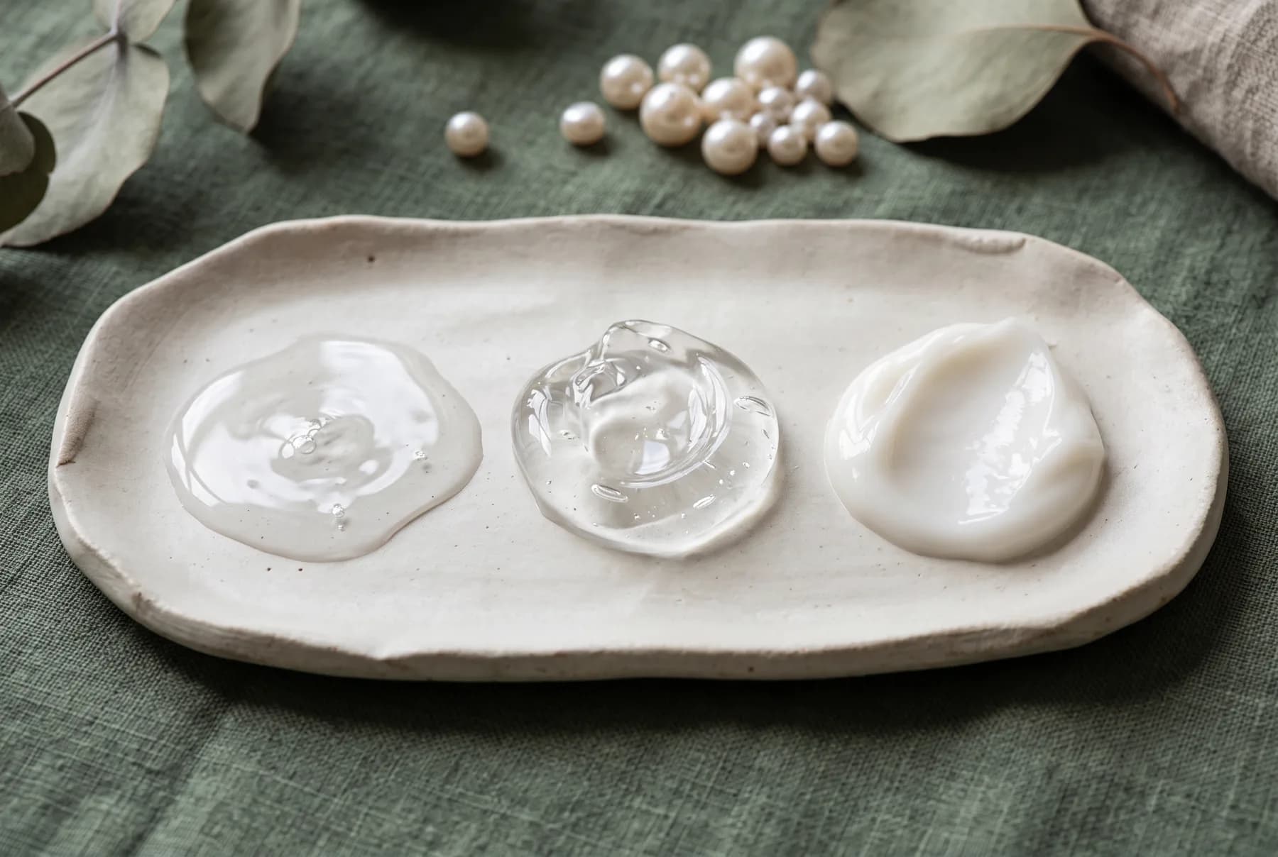 Three hydrating serum textures in clear fluid, gel, and milky gel-cream formats