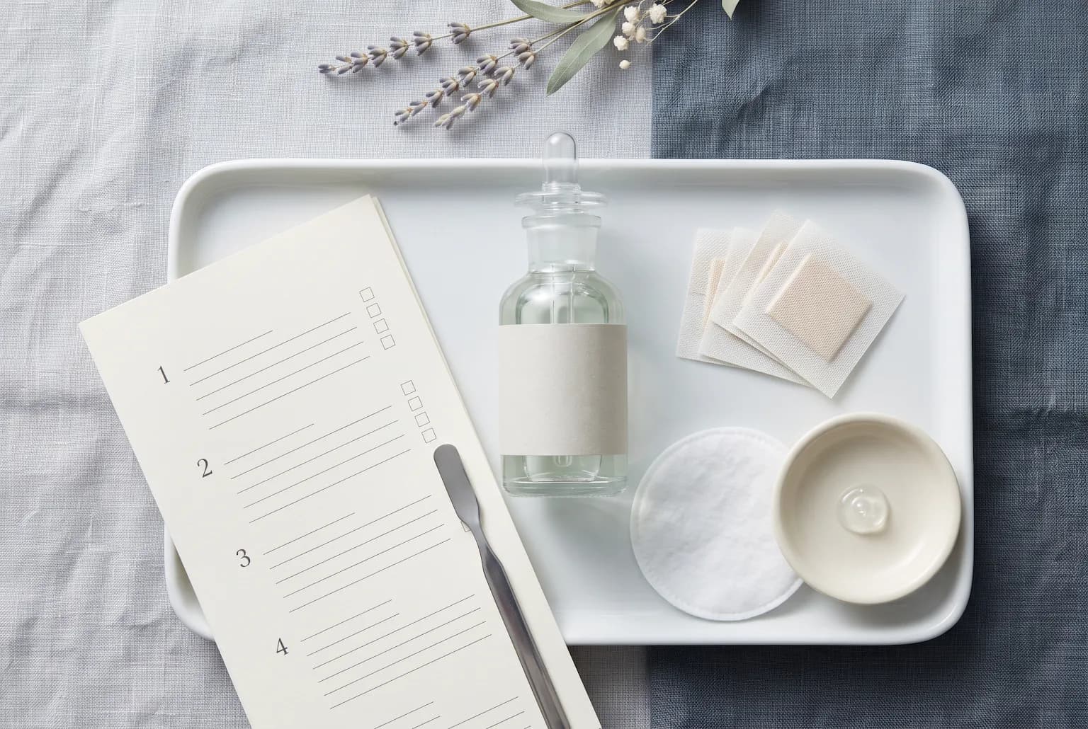 Patch test setup: bandages, cotton pad, small dropper bottle and checklist