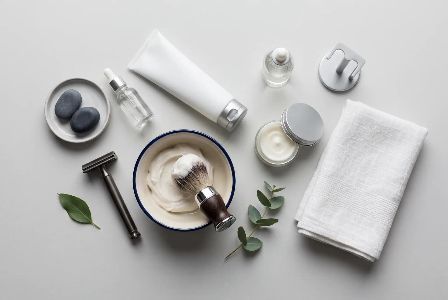 Shaving kit and post-shave essentials laid out on a white background