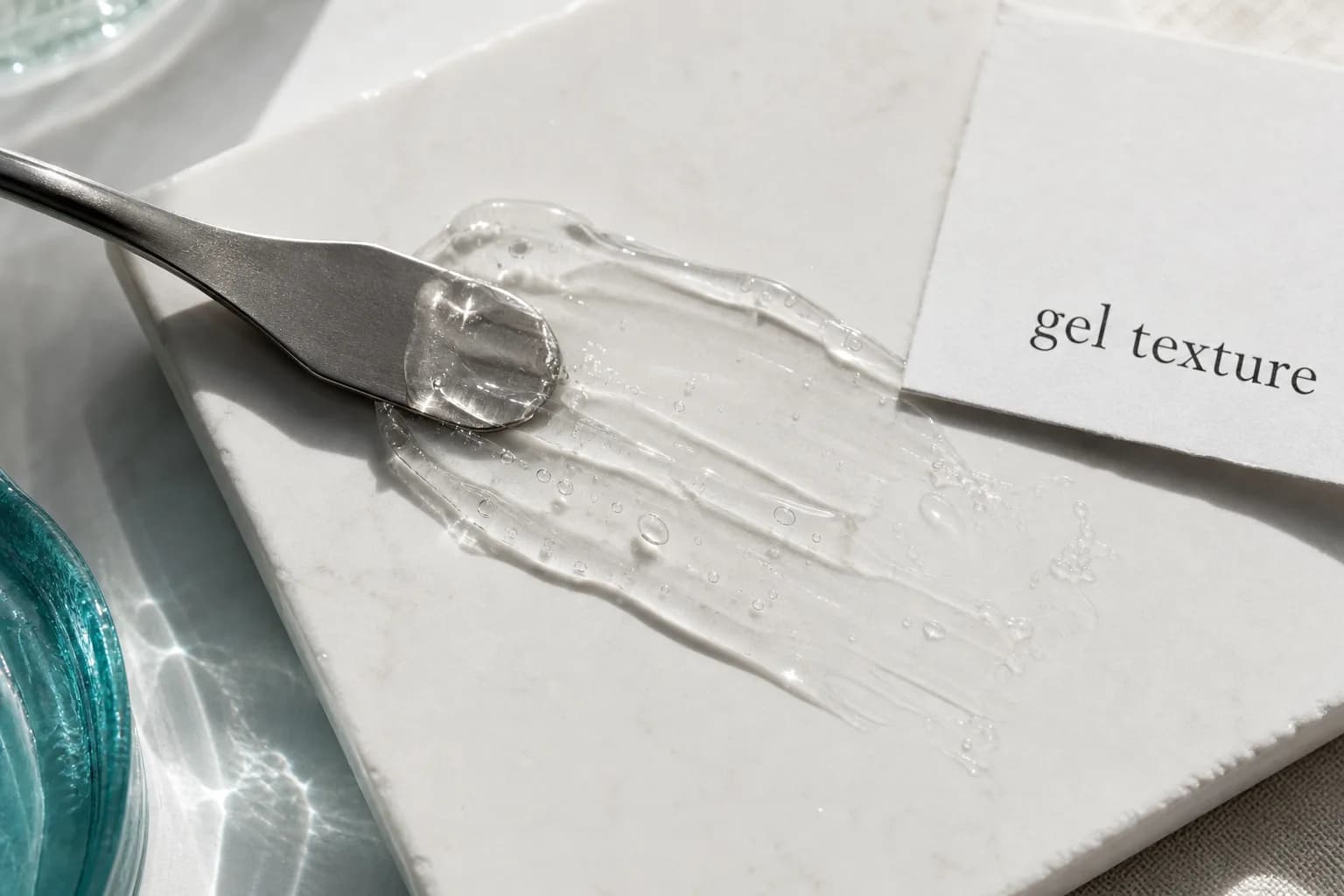 Translucent gel smear on white tile with spatula