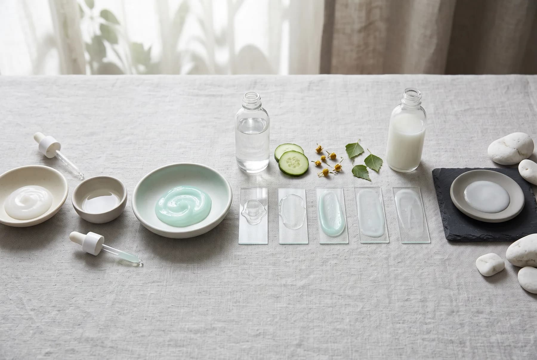 A clear serum being gently pressed onto skin