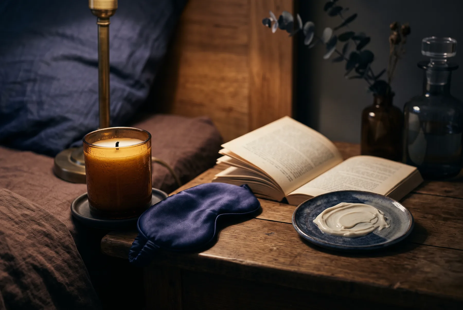 Evening bedside scene suggesting a simple nighttime skincare ritual
