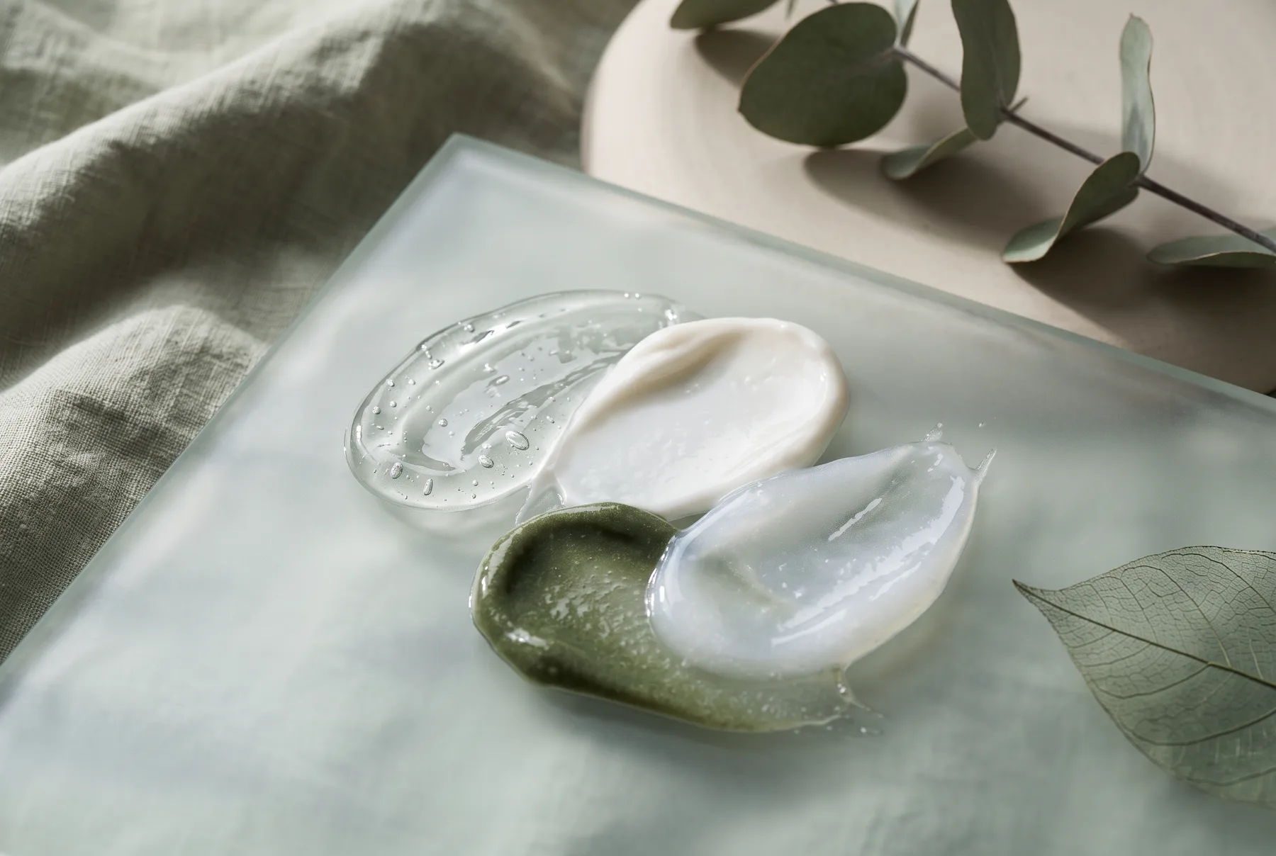 Abstract swatches showing the different textures of dark-spot skincare formulas